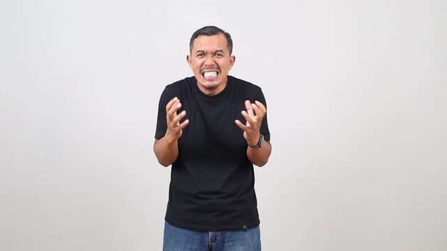 Anger, emotional, angry, scared Asian man looking at camera. Human emotions, facial expression concept