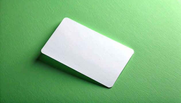 Blank white card with rounded corners casting a soft shadow on a textured green background