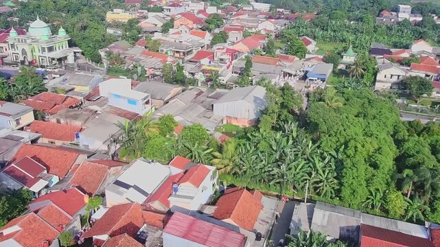 Aerial Drone View of Residential Neighborhood with Green Trees and Urban Landscape in Indonesia
