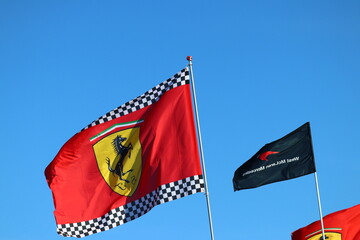 Obraz premium 22 May 2026, Montreal, Canada: Ferrari flags wave above Formula 1 fans at Grand Prix weekend. g.