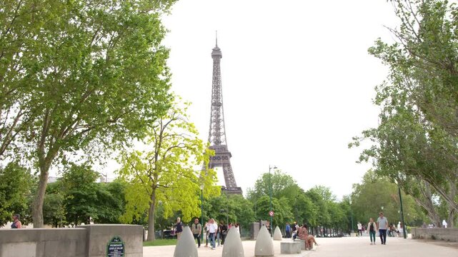 Tourists Walking Along Promenade Gisele Halimi Near the Eiffel Tower