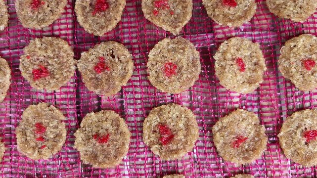 Traditional Balinese Jaje Begina Rice Cakes Drying in the Sun