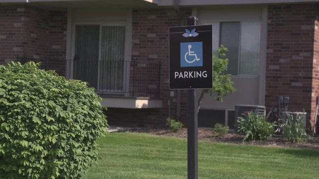 Accessible Parking Sign Post in Front of Office Building