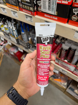 DAP Kwik Seal Plus Caulk Tube Held In Store