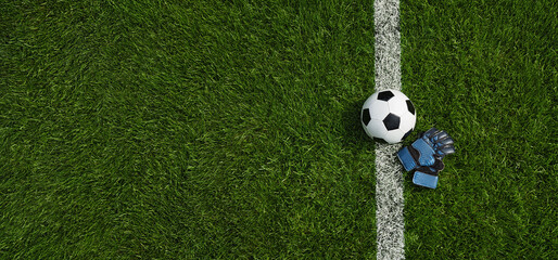 Fototapeta premium green grass texture with a soccer ball and goalkeeper gloves - well-groomed turf. Banner with copy space.