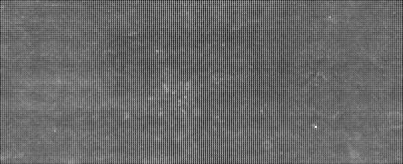 Fototapeta premium A close-up view of a dark gray textured surface with small white specks