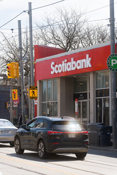 Toronto, Canada - April 17, 2026: Densely populated urban crossroads filled with public transportation and impressive