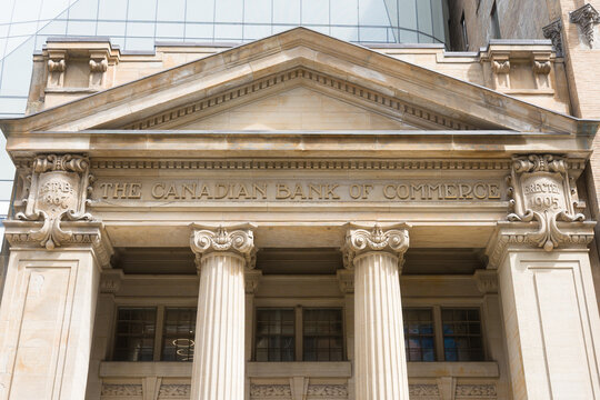 Toronto, Canada - April 17, 2026: Vintage pediment adorned with complex engraved motifs and coarse granite textures