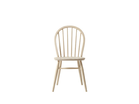Light wood spindle chair on white background, minimalist furniture for dining room or kitchen decor
