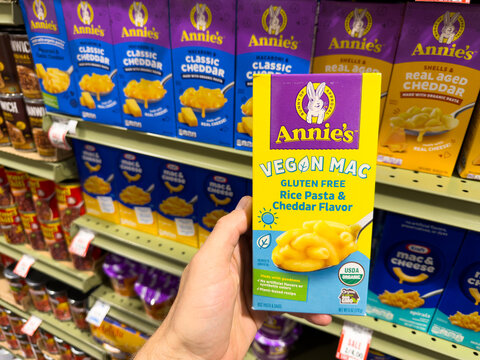 Annie's Veggie Mac Pasta Box Held in Grocery Store Aisle