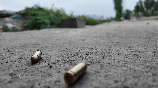 a brass cartridge casing, like those from 9mm pistols