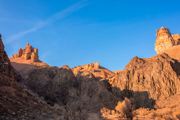 Naklejka premium Charyn Canyon, Valley of Castles. The excellence of Kazakhstan. Panorama of natural unusual landscape. The red canyon of extraordinary beauty looks like a Martian landscape.
