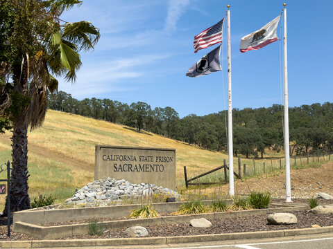 California State Prison Sacramento Sign with Flags and Hillside in Folsom California