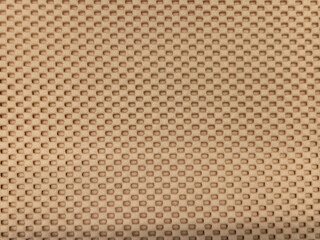 Fototapeta premium Beige rubber non-slip mat texture with small raised dots pattern