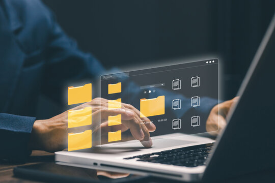 Digital file management and cloud storage concept with virtual folders and online document system on laptop, representing data organization, workflow automation and business technology.