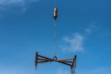 Obraz premium Crane loader for lifting bundles of precast concrete slabs. 