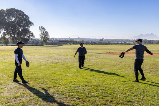 Three players in baseball glove drill on field, center stepping causing overlay path and stats