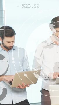 Vertical video: Two men tapping laptops and tablet, launching globe charts overlay for tech review