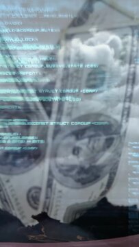 Vertical video: Camera zooming, dollars tilting as cyan code scrolling, showing money-data contrast