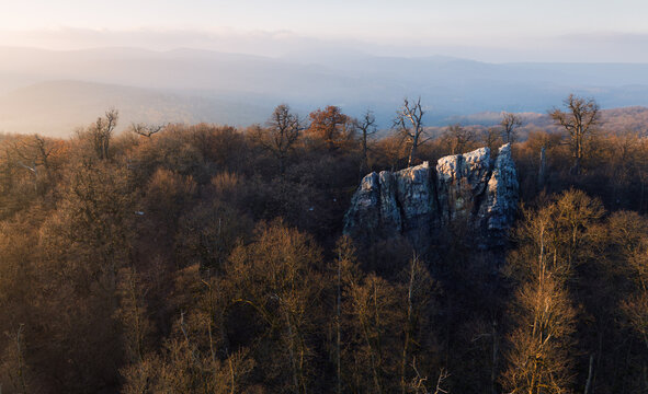  Beautiful sunset, autumn forests, rocks and hills on background. Aerial drone