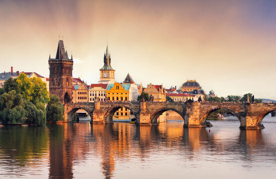 Prague - Charles bridge over Vltava river at dramatic sunset, Czech republic