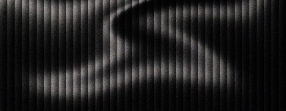 Abstract black metal texture with vertical slats and wavy light reflections, dark industrial aluminum background with rhythmic stripes, modern metallic surface for architectural web design.