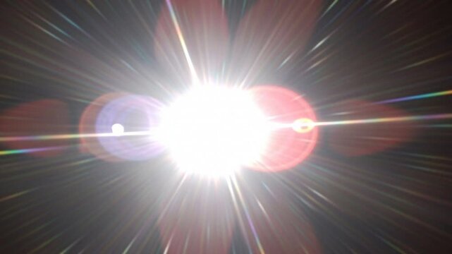 Abstract bright lens flare light burst with radial streaks and glowing particles in dark space.