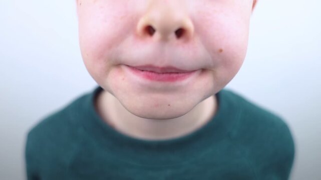 10 year old boy at pediatric dentist showing milk tooth extraction. Concept of caries treatment, physiological change of teeth and permanent teeth eruption in school age children.