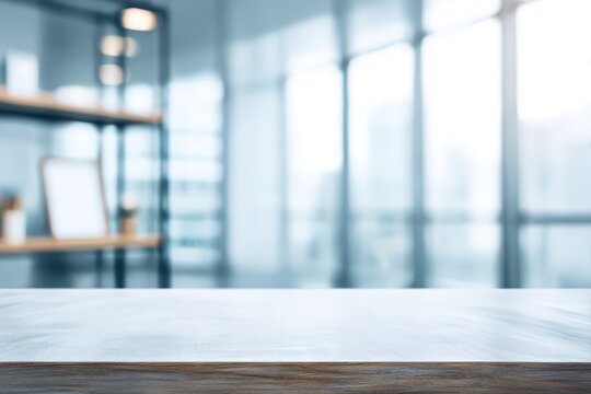 Empty wooden table with blurred office interior background. Mockup for product presentation or digital design display. Professional workspace environment for business project.