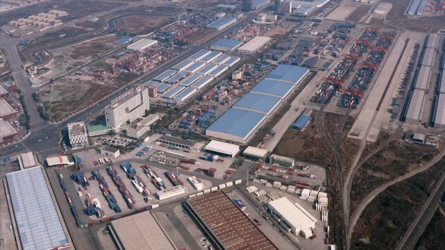 Aerial View of Shipping Container Yard and Warehouses at Freight Terminal