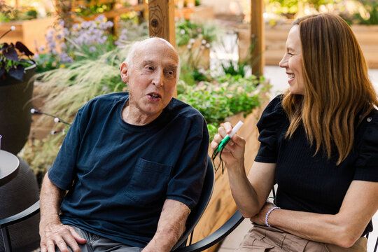 Senior man talking with woman outdoors