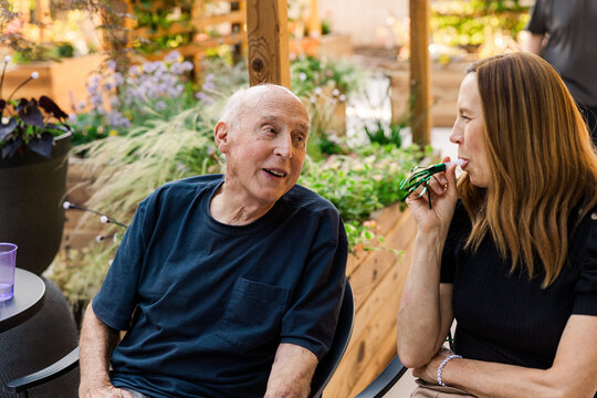 Senior man chatting with woman outdoors