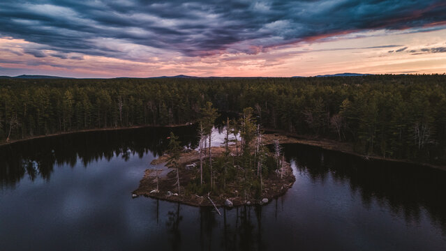 Dramatic sunset clouds over a remote island, Machias Lake, Maine