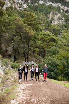 Group of female friends hiking on a mountain trail