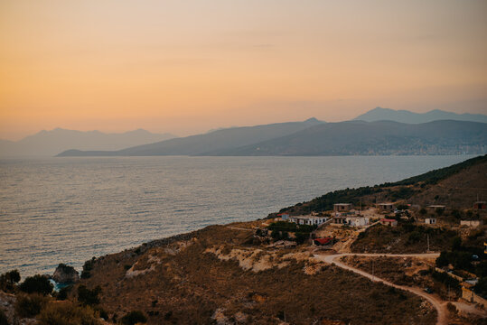 Warm sunset over a seaside village between Ksamil and Sarand&euml;