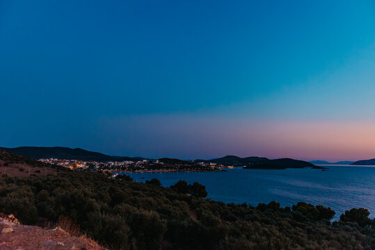 Seaside village lights glowing at dusk