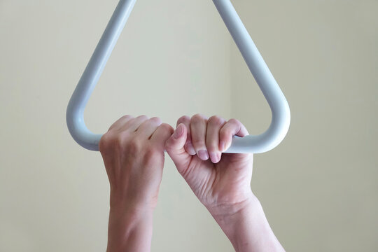 Care dependency, Senior woman holding bed gallow