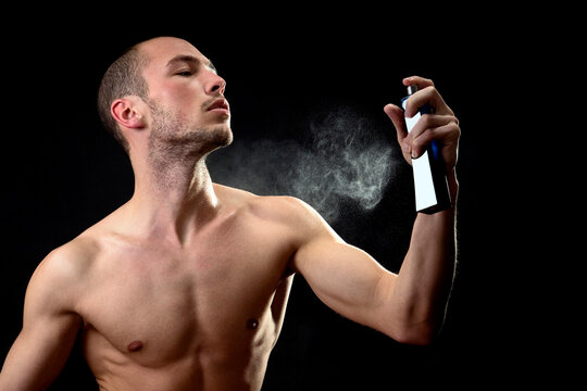 Man spraying fragrance