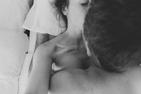 Couple having sex in bed