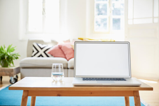 Laptop on coffee table in a modern living room of an old country house