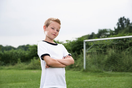Confident boy in soccer jersey