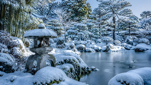 Japanese Winter Garden with Yukimi Lantern Snow Covered Stone and Frozen Pond at Dawn