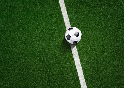 the green grass on the line in soccer stadium. Close up midfield with center point.