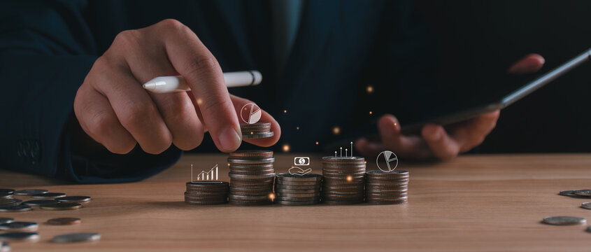 Businessman with stack growth coins. long-term financial planning, wealth management strategy, investment portfolio diversification, and capital accumulation. corporate revenue budgeting, banking.