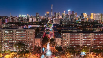 Fototapeten Bordeaux The night view of CITIC Tower in Beijing's CBD and the urban landscape of traditional residential communities.  © 文普 王