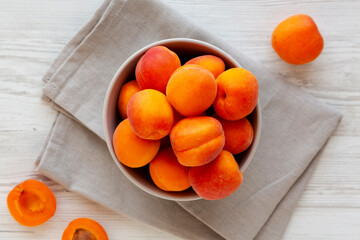 Raw Organic Apricots in a Bowl, top view. Flat lay, overhead, from above. © Liudmyla