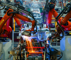 Fototapeta premium robotic arms on automated car production lines