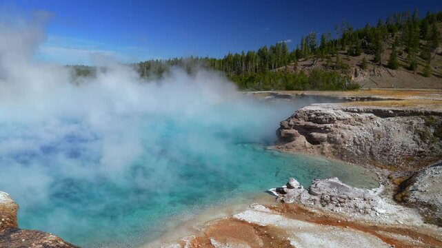 Excelsior Geyser Crater turquoise blue hot springs Grand Prismatic Spring Midway Boardwalk Fairy Falls trail Mid Geyser Basin Wyoming USA Yellowstone National Park nature landscape sunny morning pan