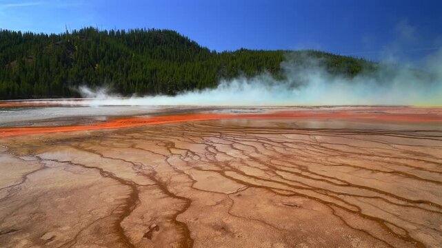 Grand Prismatic Spring vibrant colorful hot springs steam pool mineral layers Midway Boardwalk Fairy Falls trail Mid Geyser Basin Wyoming USA Yellowstone National Park nature landscape sunny morning