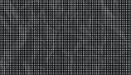 Fototapeta premium A dark crumpled paper texture fills the frame with many creases